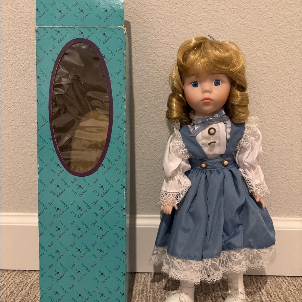 Vintage 17” porcelain doll Sara, blonde hair, blue/white dress, fair condition